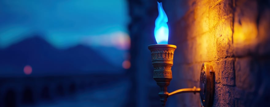Blue flame torch, wall mount, night scene, mountains photo