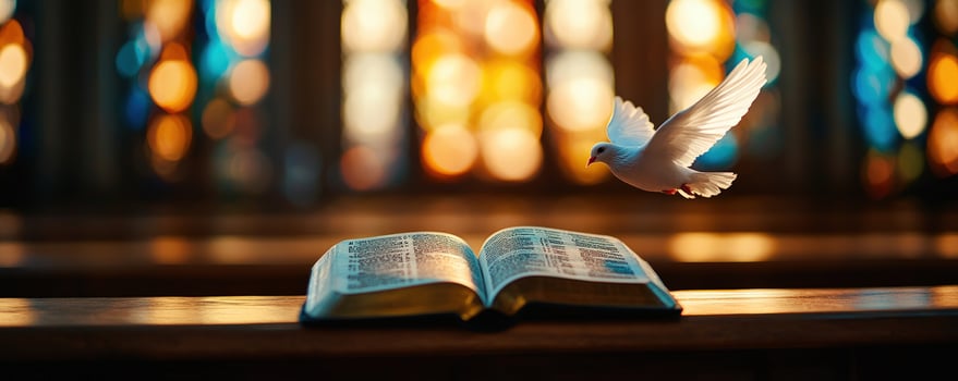 Dove flies above open Bible in church, stainedglass backdrop faith concept photo
