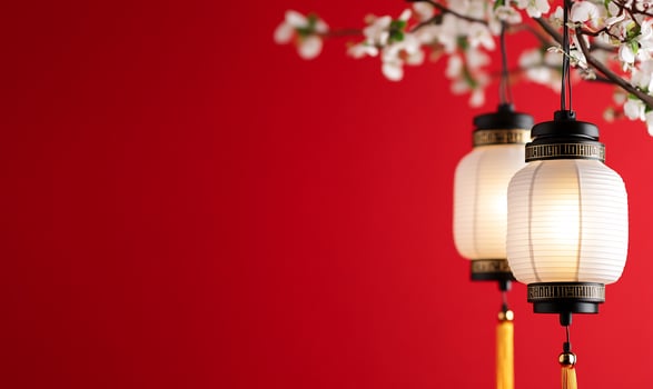 Red background with traditional lanterns and floral branch decoration photo