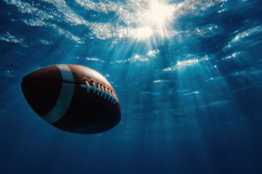 Underwater football, sun rays, ocean, sunken, sports photo