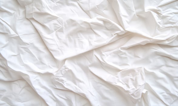 White fabric texture background with folds and creases photo
