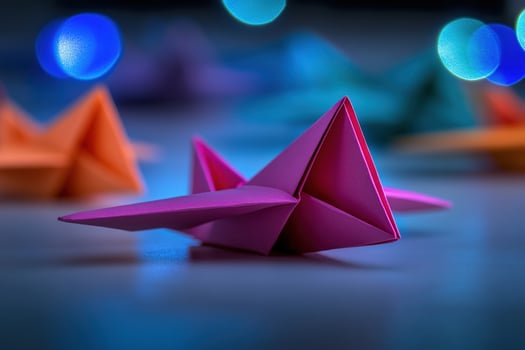 Pink origami star, colorful bokeh, table, craft photo