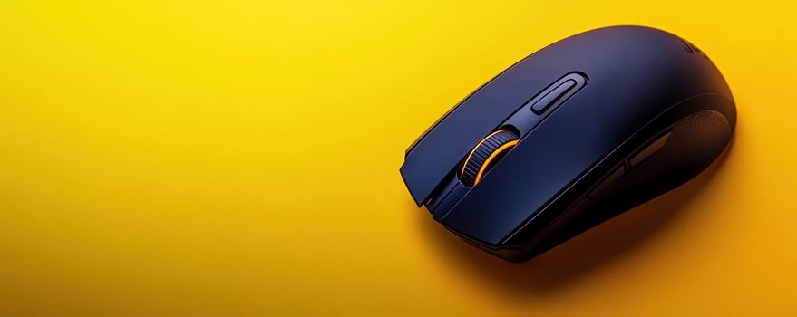 Wireless computer mouse on yellow, copy space photo