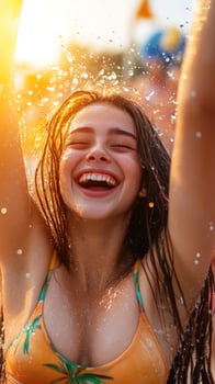 Happy woman splashing water, summer festival, sunset photo