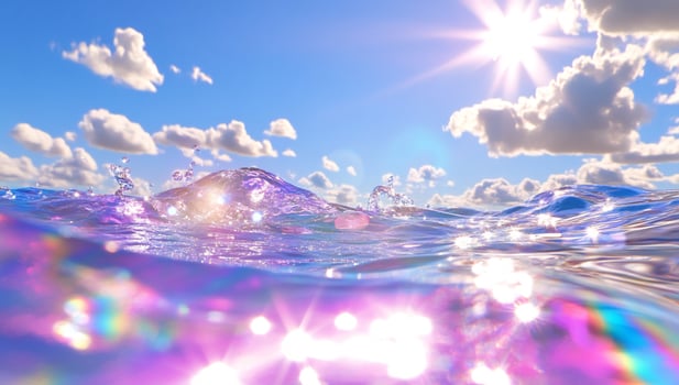 Ocean water surface and underwater view under bright sunlight with clouds photo