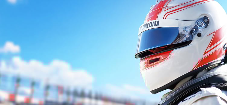 Racing driver in helmet ready for competition against blurred sky and racetrack background photo