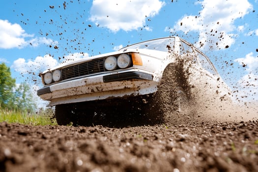 Off road vehicle driving through muddy terrain photo