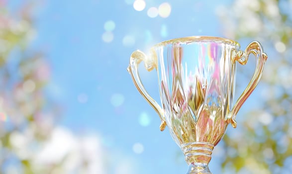 Elegant golden trophy on abstract background celebrating success and achievement photo