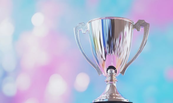 Silver trophy shines against abstract bokeh background symbolizing success photo