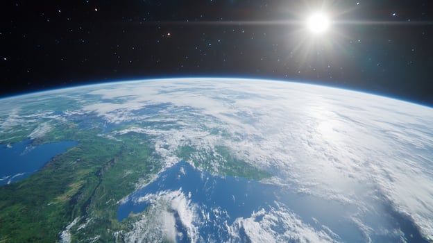 Earth from space planet overview with sunlight and starry background photo