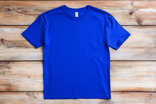 Vivid blue t shirt on rustic wood surface apparel mockup photo