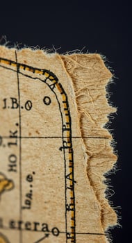 An old map of the world on a piece of paper photo
