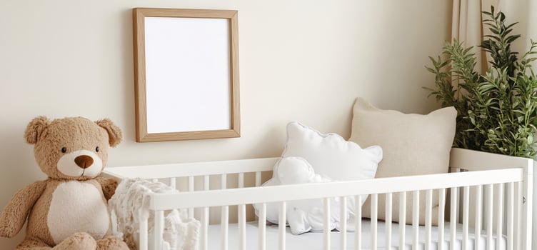 Baby nursery interior with crib and teddy bear frame mockup photo