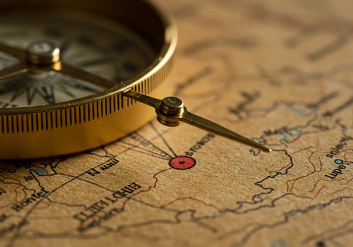 Antique Compass on Vintage Map Adventure Awaits. photo