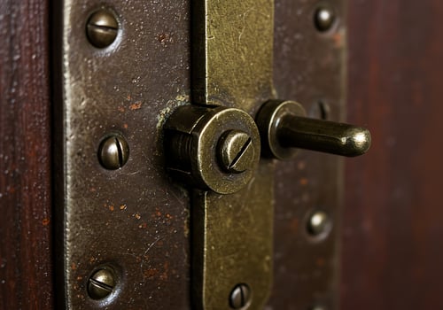 A close up of a metal latch on a wooden door photo