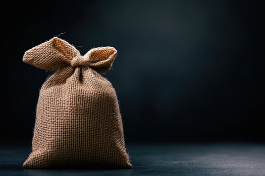 Burlap sack, tied, dark background photo