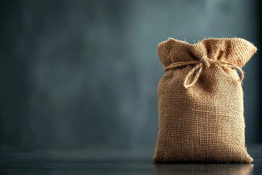 Burlap sack, tied, dark background, rustic table, product display photo