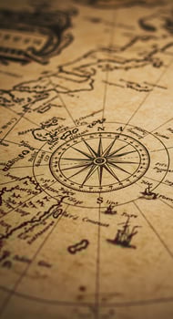 An old map with a compass on it photo