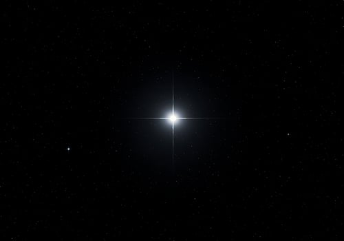 A bright star in the night sky photo
