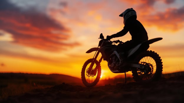 Sunset biker silhouette, hilltop, adventure, freedom photo