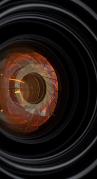 An orange and black spiral with a black background photo