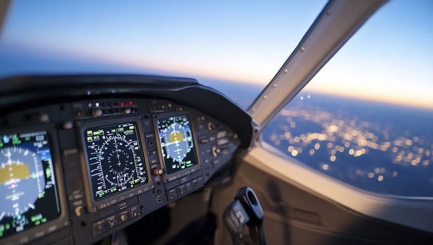 Aircraft cockpit view of city at twilight flight control panel display and technology photo