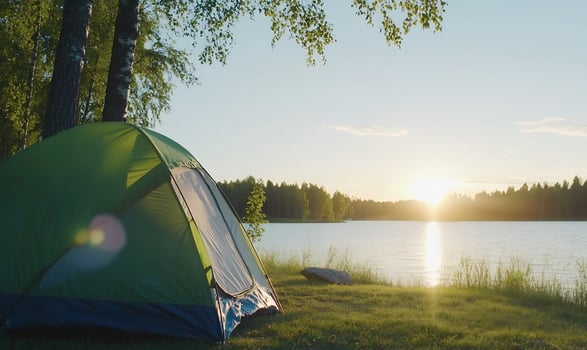Tranquil lakeside camping at sunset nature adventure and outdoor getaway photo
