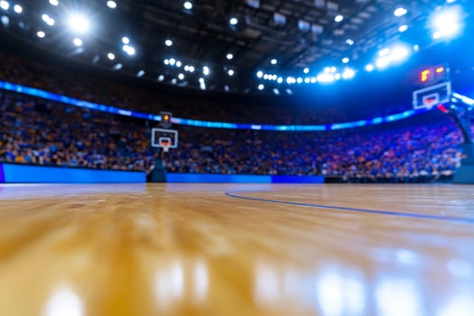 Sports arena shiny wooden floor with blurred audience and basketball hoops photo
