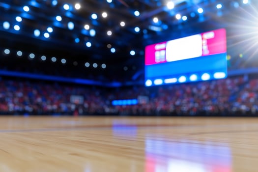 Indoor sports arena with wooden court and scoreboard blurred background photo