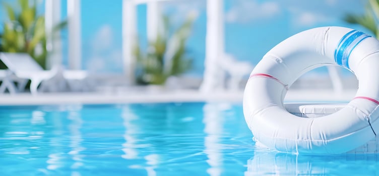 Tranquil pool scene with life preserver floating on azure water for travel and summer vacation photo