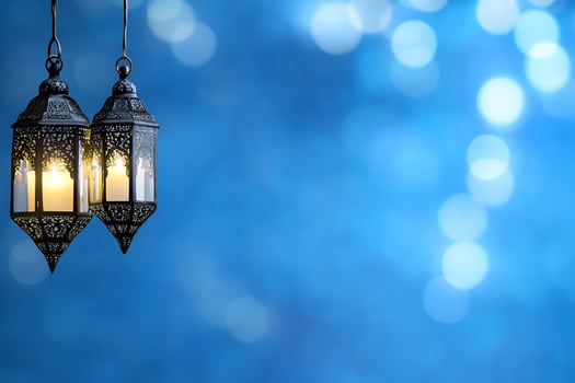 Decorative lanterns with bokeh light effects against blue backdrop photo