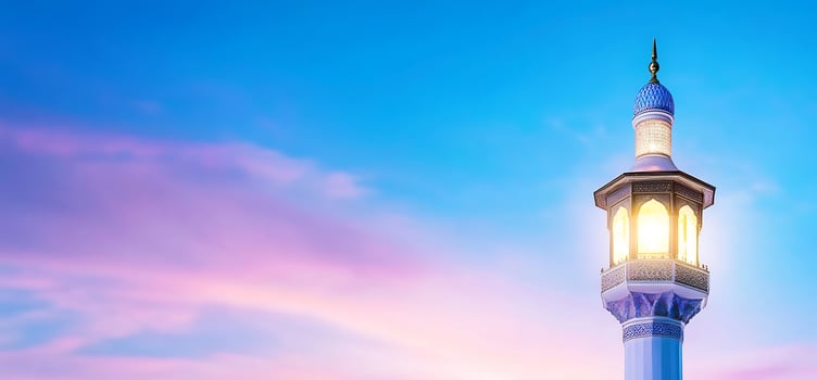 Majestic minaret tower at sunset architectural silhouette against colorful sky photo