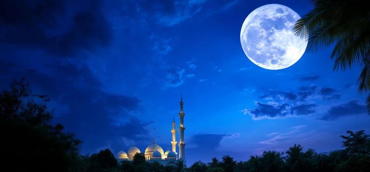 Illuminated mosque under full moon night sky cultural landmark photo