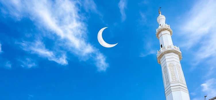 Mosque minaret under blue sky and crescent moon spiritual landmark photo