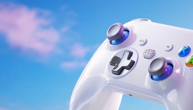 White gamepad controller close up on blue sky background for gaming entertainment photo