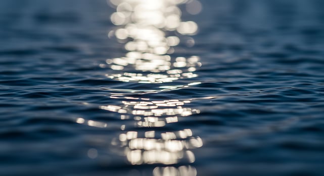 Sun shining on water surface photo