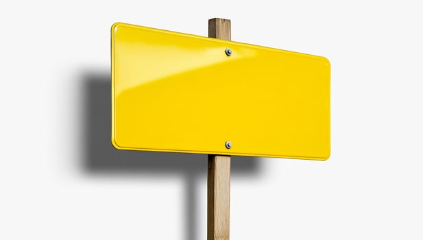 Yellow signboard on wooden post for information or direction with copy space photo