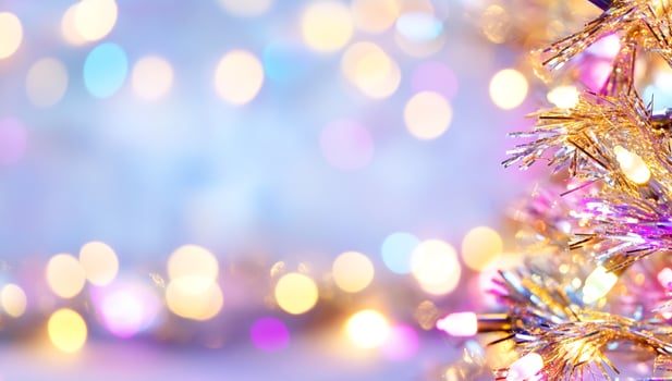 Dreamy bokeh lights and golden tinsel for festive celebration background photo