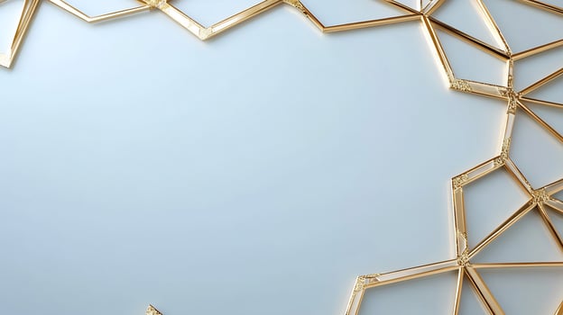 Golden polygon frame on light blue background with copy space photo