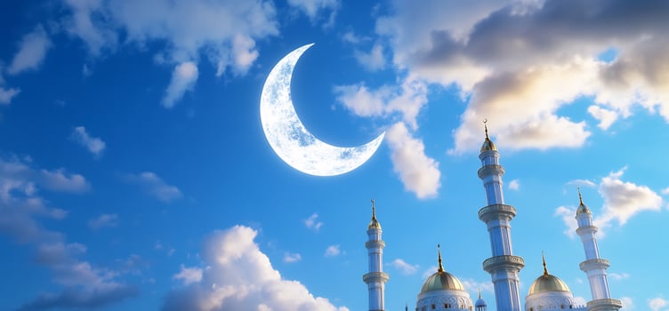 Crescent moon over building domes and minarets on a cloudy day peaceful sky architecture photo