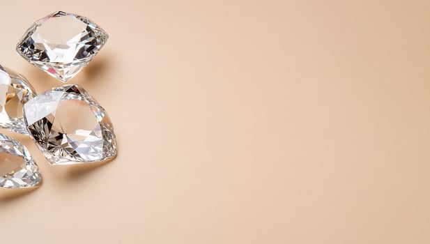 Sparkling gems with copy space on beige background photo