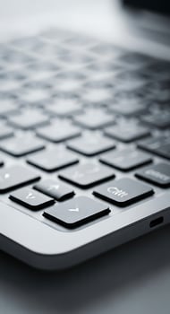 Close up of a laptop keyboard with a mouse photo