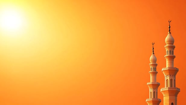 Minarets silhouette against orange background religious architecture and cultural symbolism photo