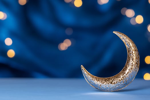 Decorative crescent moon on blue background with bokeh lights festive celestial design photo
