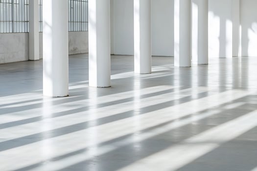 Minimalist architectural space with sunlight and pillars photo