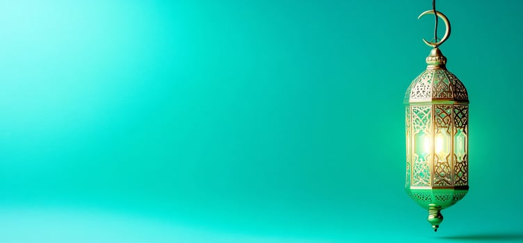 Ornate lantern hanging against teal background festive celebration light symbol photo