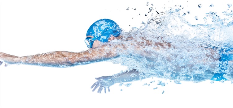 Dynamic swimmer in motion with water splash on white background photo