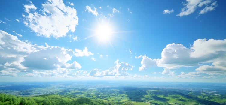 Vast blue sky with fluffy clouds over green rolling hills sunny day nature landscape photo