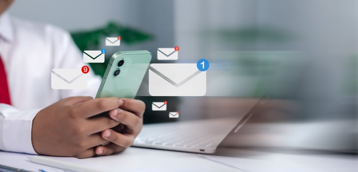 Email, contact, online communication, messaging, and business correspondence in a modern office. Close-up of businessman holding smartphone with digital email icons and notifications. photo