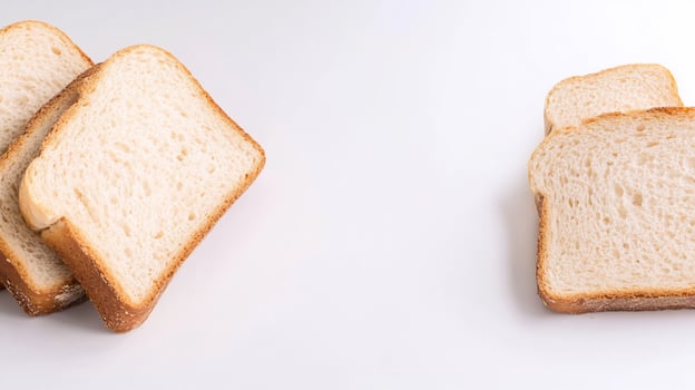 Sliced sandwich bread golden crusts on white background photo